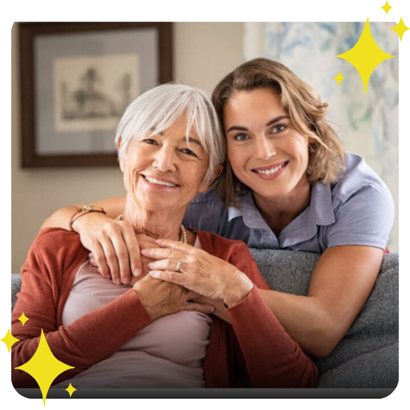 a nurse hugging an older woman